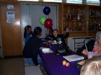 students eating together at lunch with balloons