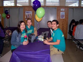 group at a table with balloons